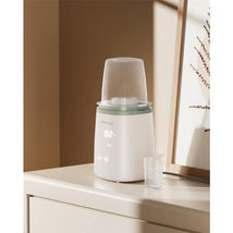 Momcozy - 6-in-1 Fast Baby Bottle Warmer Image 1