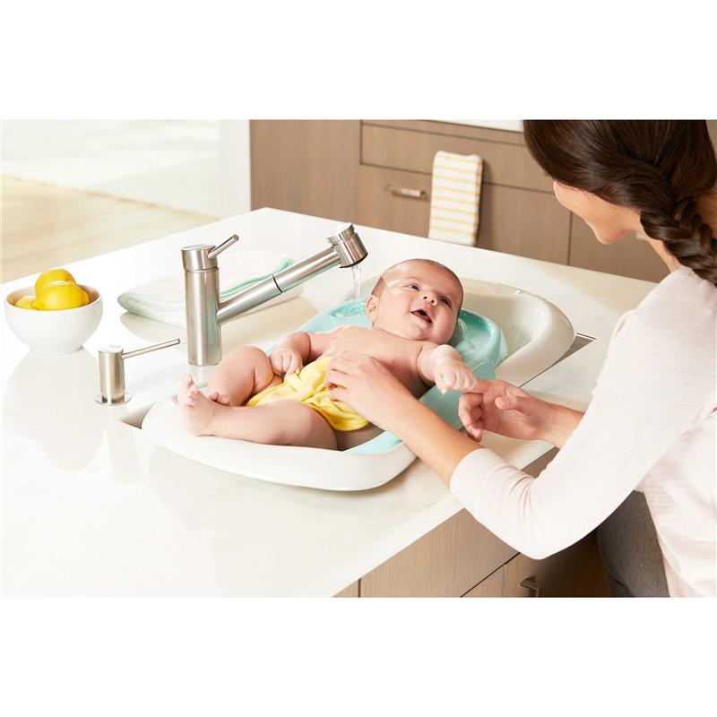 https://www.macrobaby.com/cdn/shop/files/the-first-years-4-in-1-warming-comfort-tub-teal-white_image_9.jpg?v=1703691982
